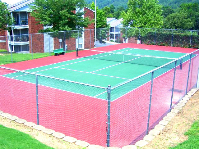 a tennis court with a fence around it